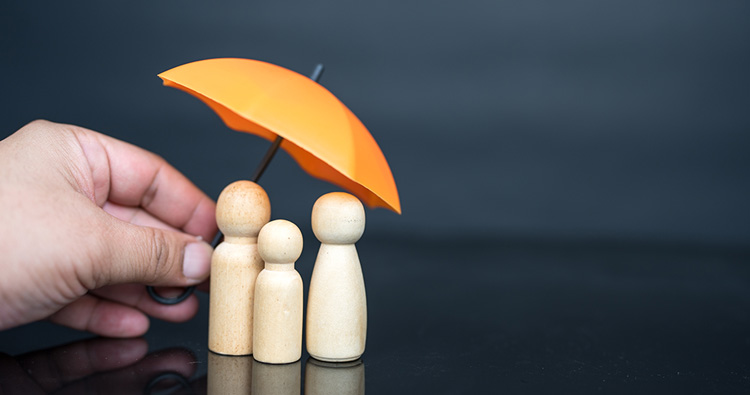 image of a hand holding a mini yellow umbrella over 3 people game pieces