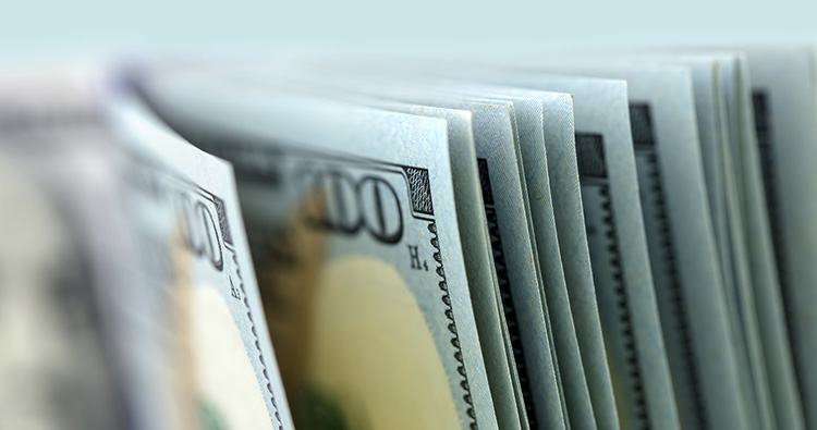 a closeup image of $100 bills