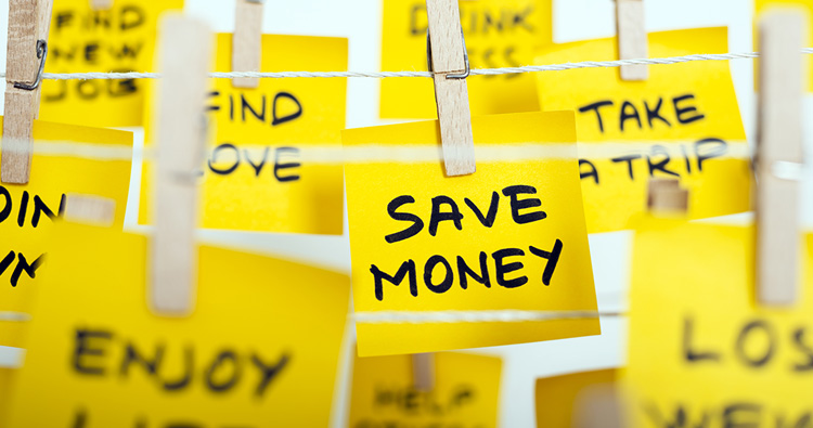 An image of various yellow post-its clipped to a clothes line with script writing on them.